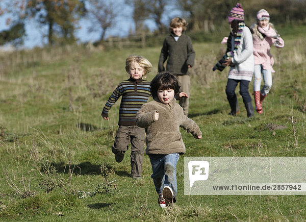 Children running in countryside