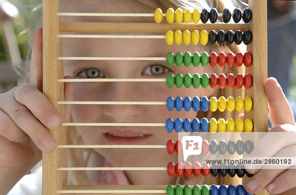 Girl (7-8) with Abacus  close-up
