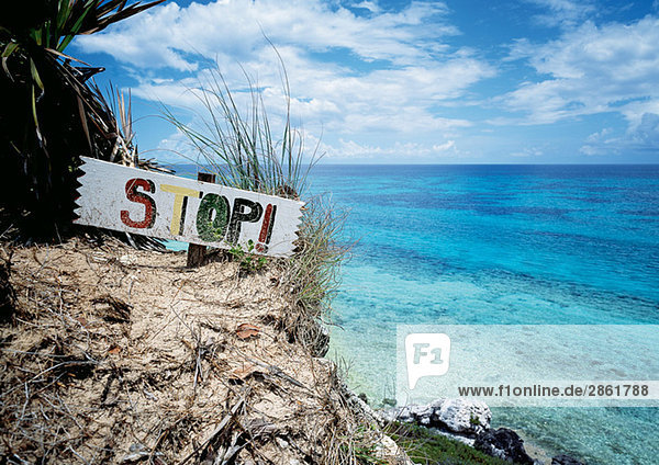 Bahamas  Stop sign on beach