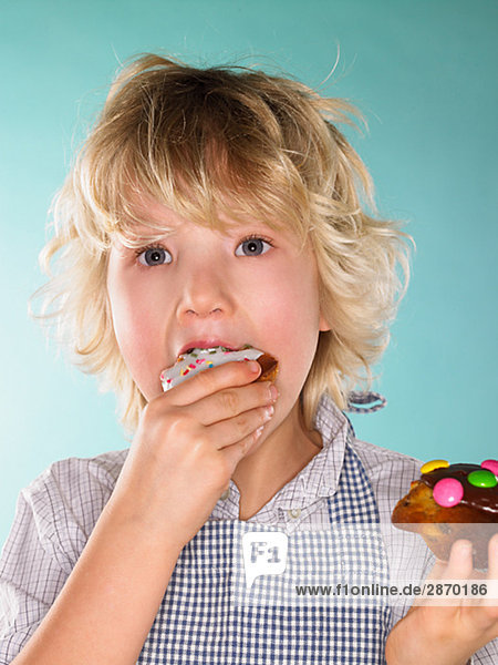 A boy eating a muffin Denmark.