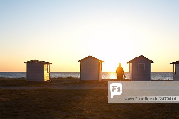 Bathing huts by the sea in the evening Sweden.