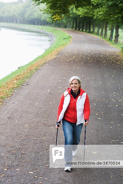 A woman pole walking Sweden.