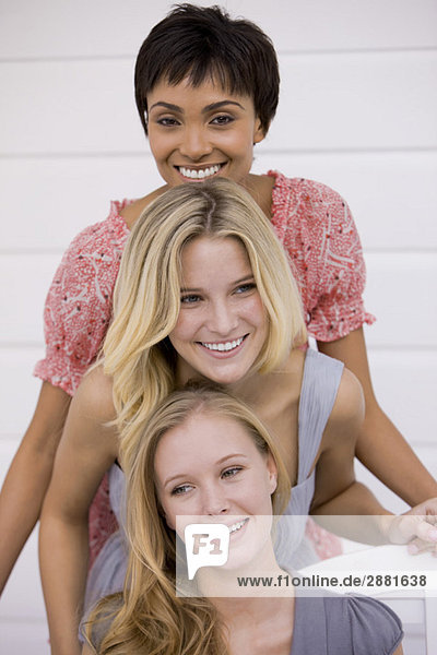 Portrait of three women smiling