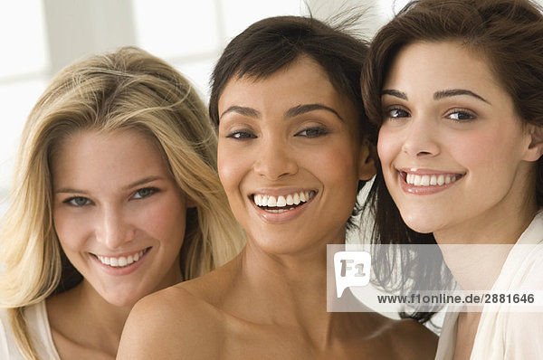 Portrait of three female friends smiling