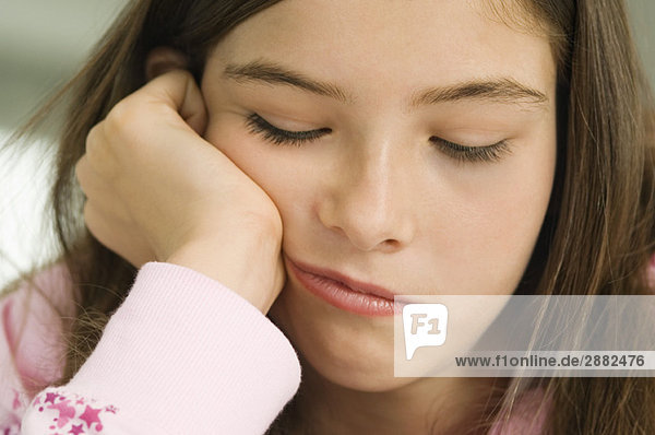 Close-up of a girl thinking