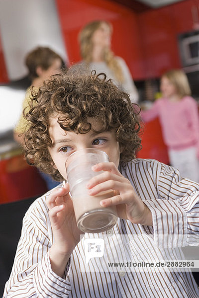 Close-up of a boy drinking a glass of milk