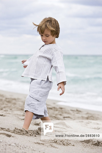 Boy playing on the beach