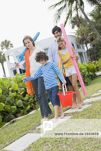 Family walking in the garden of a tourist resort