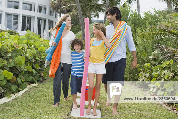 Family standing in the garden of a tourist resort