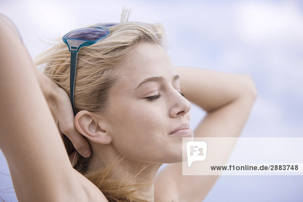 Close-up of a woman day dreaming