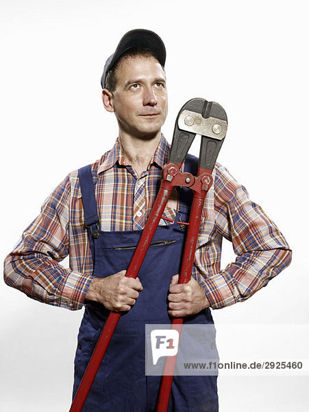 A man holding bolt cutters