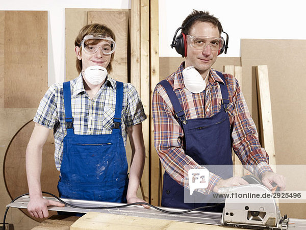 Portrait of two men in a wood workshop