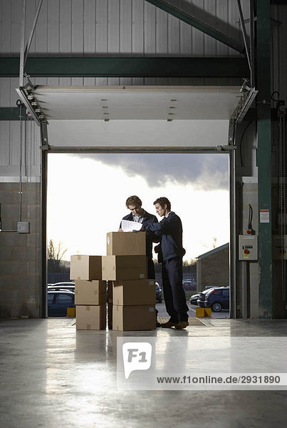 Two workers in warehouse