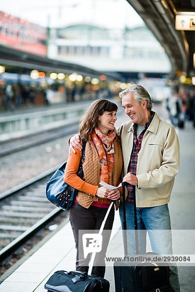 A man and woman on a platform at a railway station Sweden.