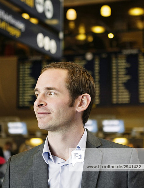 Man standing in departure hall