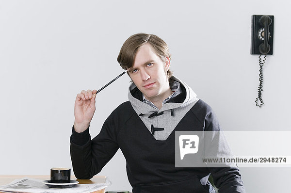 Portrait of a man sitting at desk
