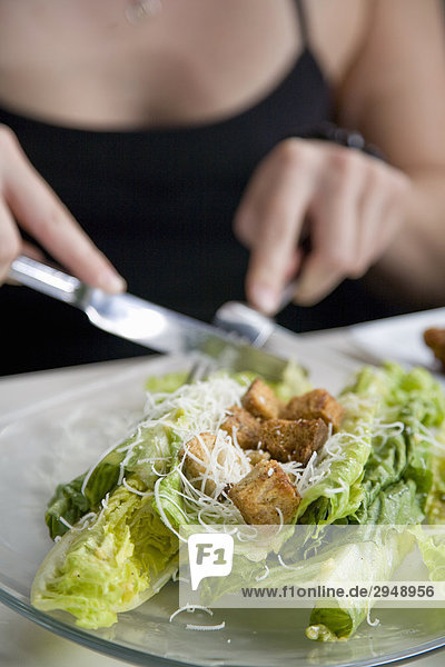 Woman eats caesar salad  Spokane  Washington