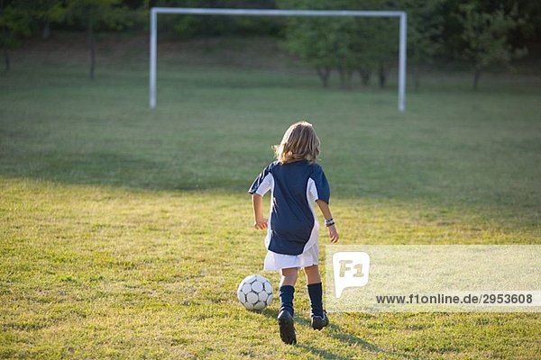 Soccer Boy Running towards Goal