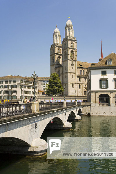 At the Limmat with the Grossmuenster Cathedral  Zurich  Switzerland