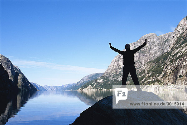Man standing near lake
