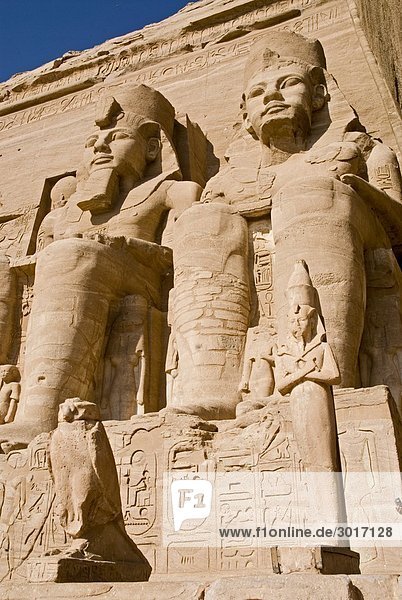 Colossal statues at the Temple of Ramesses II in Abu Simbel  Egypt  low angle view  close-up