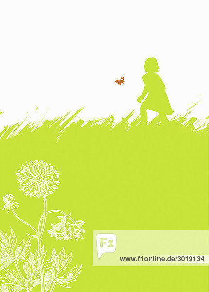 Girl chasing butterfly in field