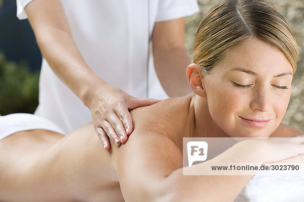 Young woman receiving massage