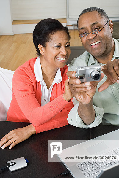 Mature couple with digital camera