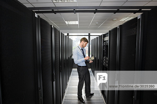 Computer technician working on a server
