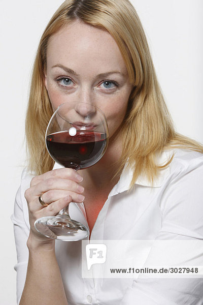 Young woman drinking red wine  portrait