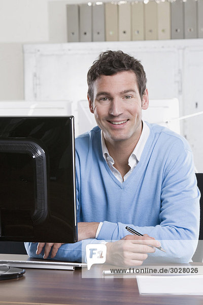 business man working in office  smiling  portrait