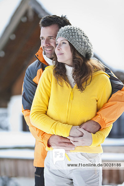Germany  Bavaria  Couple in winter clothes  embracing