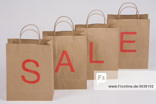 Paper bags forming the word Sale  close-up