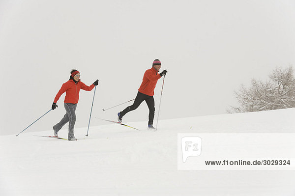 Italy  South Tyrol  Couple cross-country skiing
