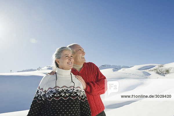 Italy  South Tyrol  Seiseralm  Senior couple in winterly landscape