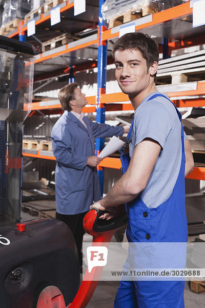 Germany  Neukirch  Apprentice and foreman in storeroom