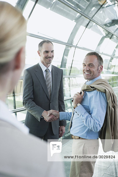 Germany  Leipzig-Halle  Airport  Business people shaking hands  smiling