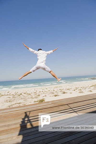 Man jumping on the beach