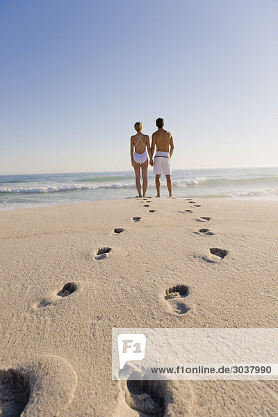 Couple standing on the beach