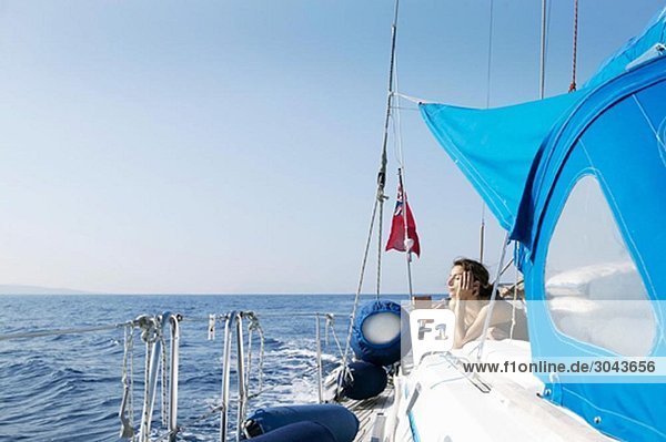 Woman Relaxing on Sailing Boat