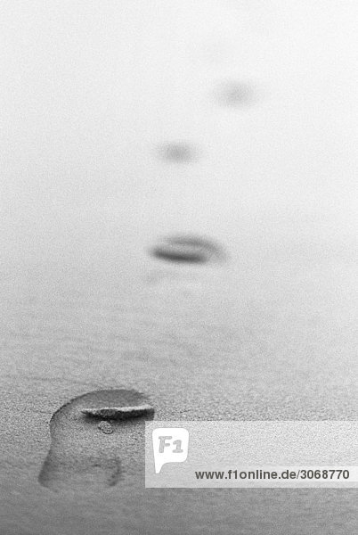 Shoeprints in sand  b&w