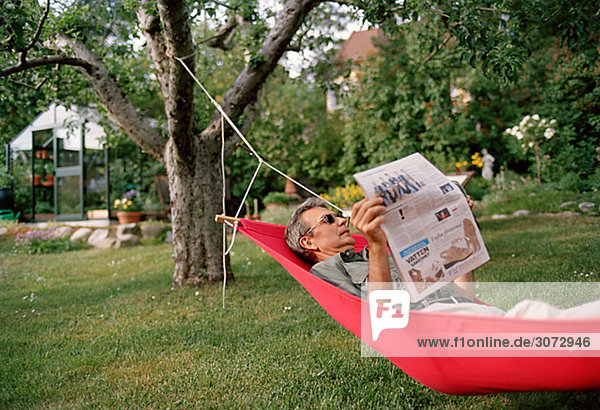 A man in a hammock Sweden.