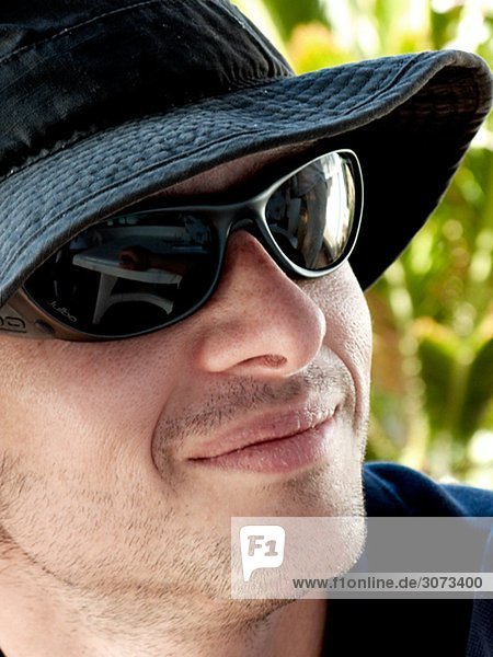 A smiling man wearing sunglasses the Canary Islands.