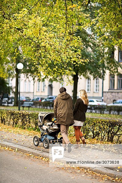 A couple taking a walk with their son Sweden.