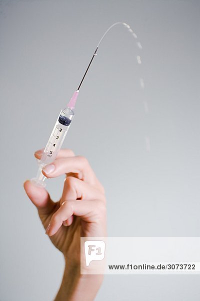 Nurse injecting close-up.