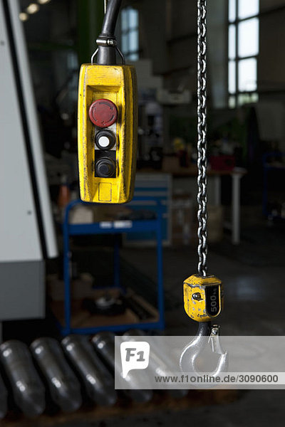 A chain hoist and its control in a metal parts factory