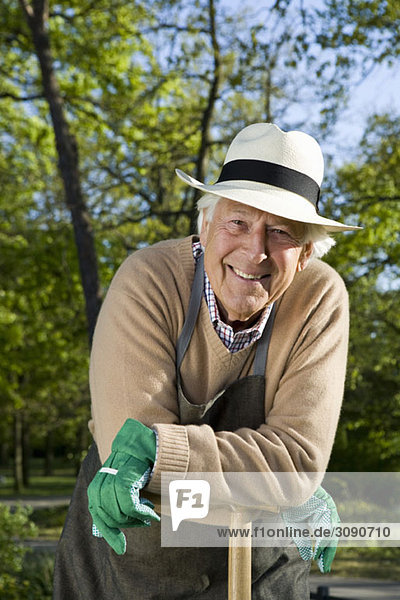 A senior man taking a break from gardening