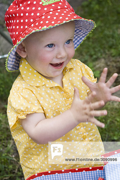 Portrait of a toddler clapping  close-up