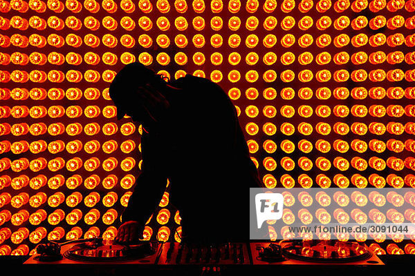 A DJ playing records at nightclub