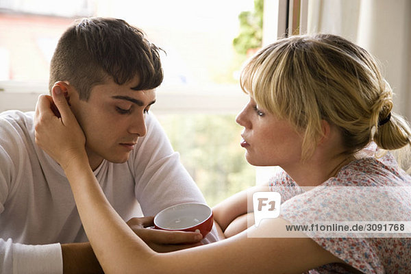 A girlfriend comforting her boyfriend